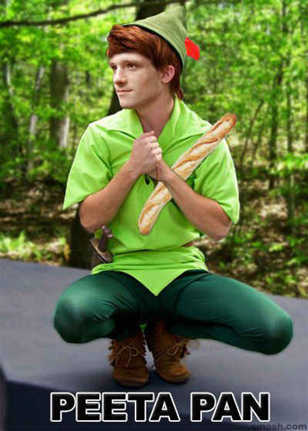 Peeta Pan is crouching in the woods, holding a piece of bread that's so pucking punny.