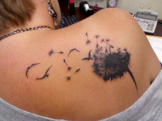 A daring tattoo on the back of a woman that falls under the category of "Tattoos You'd Have to Be Nuts to Get.