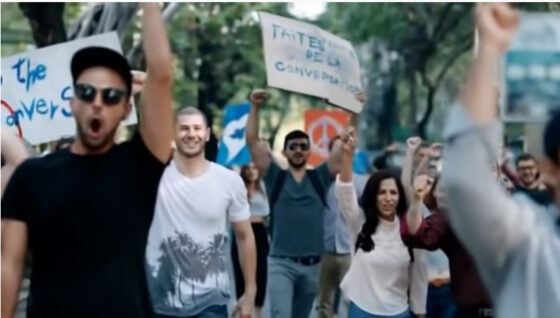 Protesters holding signs.