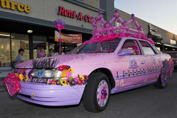 A WTF car adorned with flowers and a tiara.