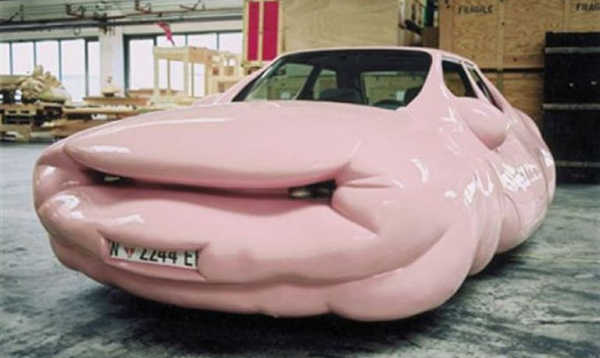 A WTF car with a pink face on it.