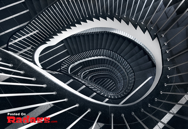 A black and white image of a stunning spiral staircase captured in high quality photography.
