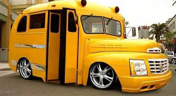 A yellow school bus is parked on the side of the road.