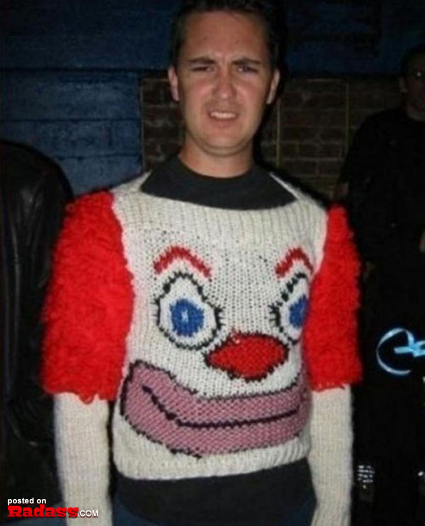 A man wearing a clown face sweater.