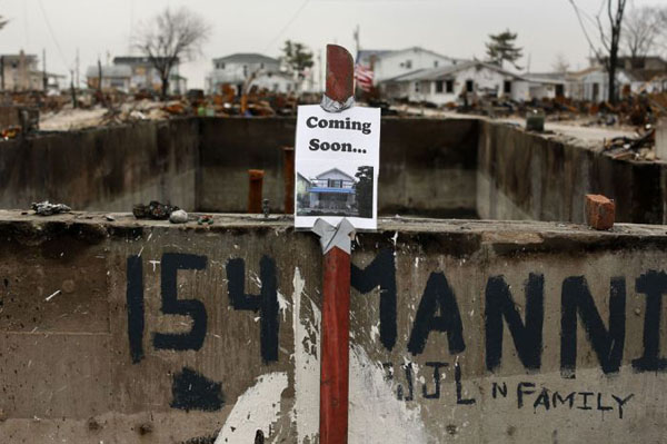 80 days later, a sign is posted on the side of a burned out house in the aftermath of Hurricane Sandy.