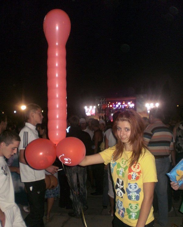 A girl holding a large red balloon, part 2.