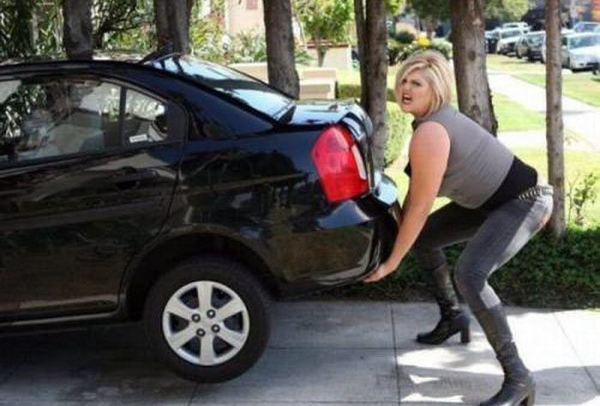 A woman pushing a black car into a driveway while dating struggles arise.