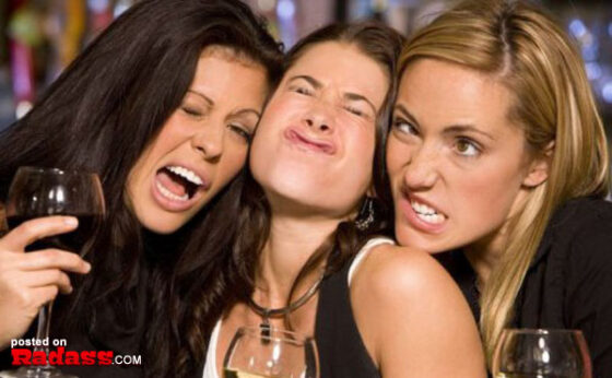 Three women are laughing while holding glasses of wine, jokingly saying "I Would Date You But…