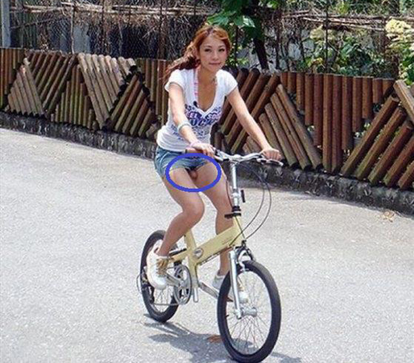 A woman riding a bicycle with a circle on it, representing the Keywords: I Would Date You But…
