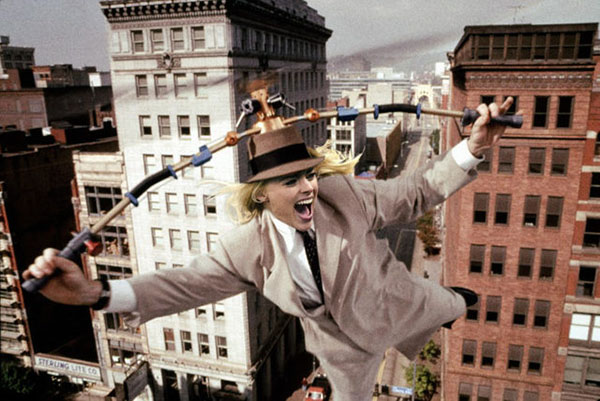 A man in a suit with Margot Robbie flying in the air is the ultimate Photoshop treatment.