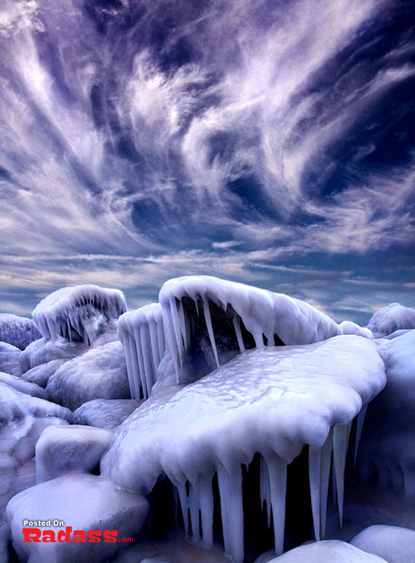 Ice covered rocks under a cloudy sky, a wonderful world.