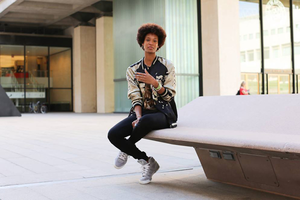A woman sitting on a bench, captured by Humans of New York photographer Brandon Stanton.