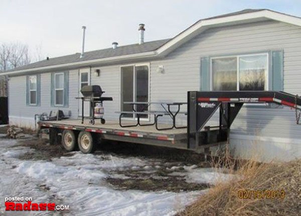 A trailer with a grill on the back of it, perfect for indulging in some Redneck Remedies while on the go.
