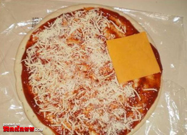 A cheesy pizza, wrapped in plastic.