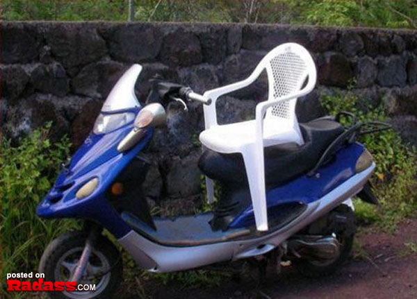 A scooter with a white chair on it, designed for comfort and convenience.