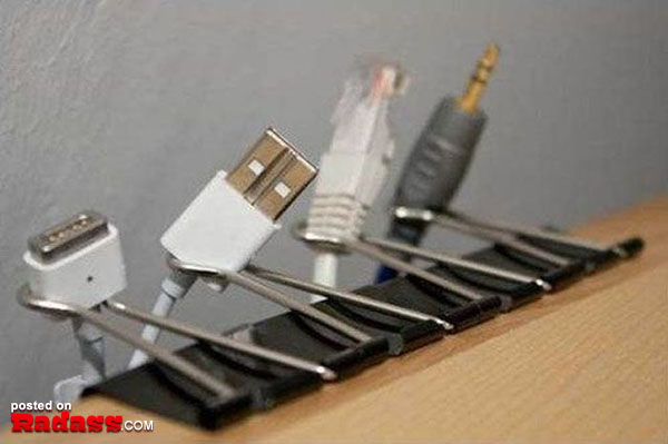 A rack with a bunch of USB cables attached to it.