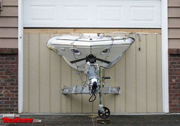 A boat is securely fastened to the side of a garage, serving as both a functional addition and an eye-catching display.