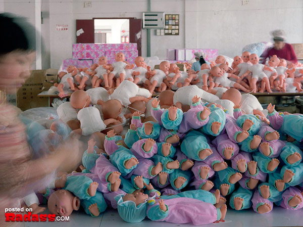 A pile of baby dolls in a real look inside Santa's Workshop.