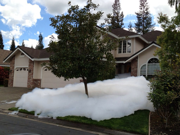 Foam in front of a house, where things could be worse.