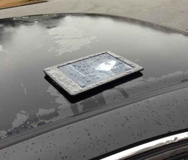 A tablet computer on the hood of a car, making you smile.