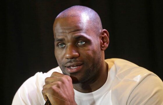 Lebron James, NBA player, speaks into a microphone.