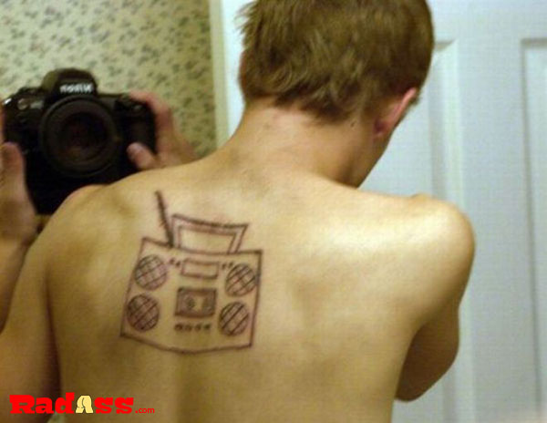 A man sporting an intriguing radio tattoo that embodies the spirit of living in the moment.