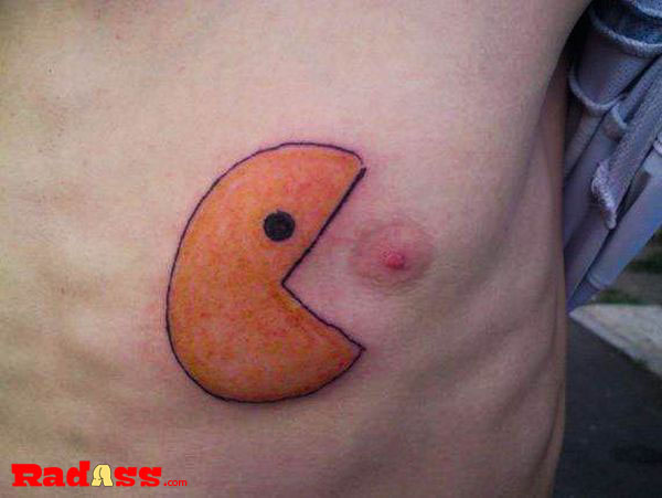 A man passionately embraces the present moment with his unique pacman chest tattoo.