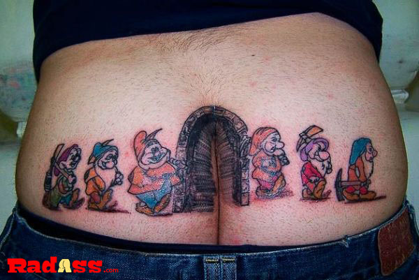 A tattoo featuring a man surrounded by cartoon characters, showcasing unique designs that you would admire but not necessarily choose for yourself, capturing the essence of living in the moment.