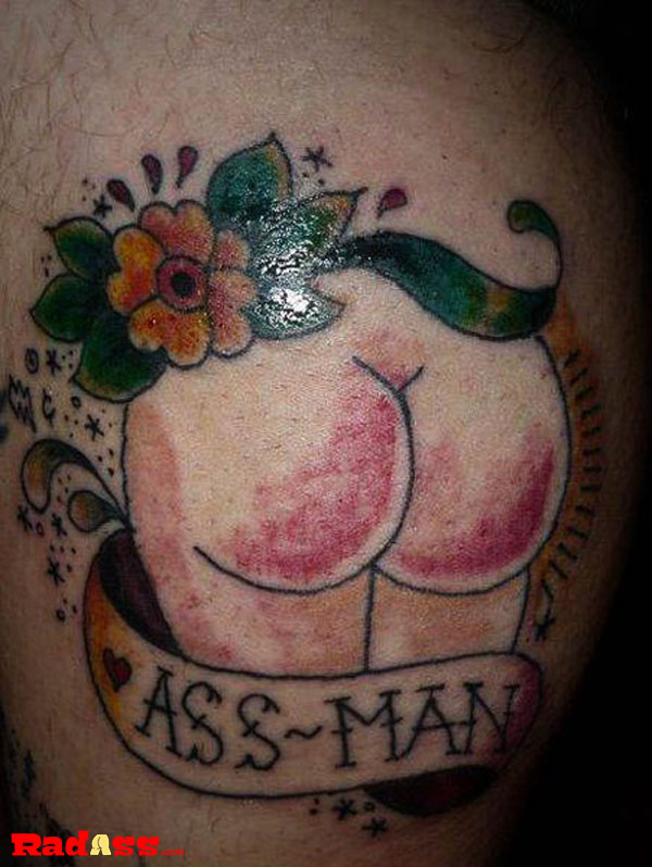 A tattoo showcasing the word 'ass man' that embraces living in the moment and falls into the category of tats you would never get but love to see.