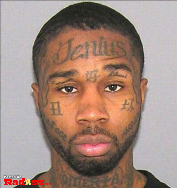 A man with face tattoos.