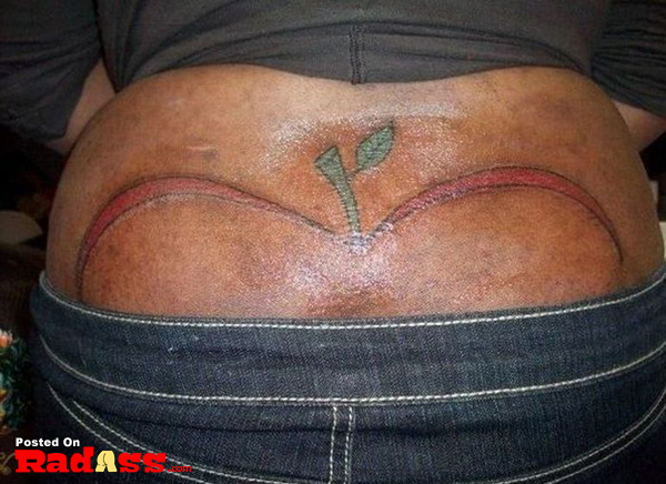 A woman with a permanent apple tattoo on her back.