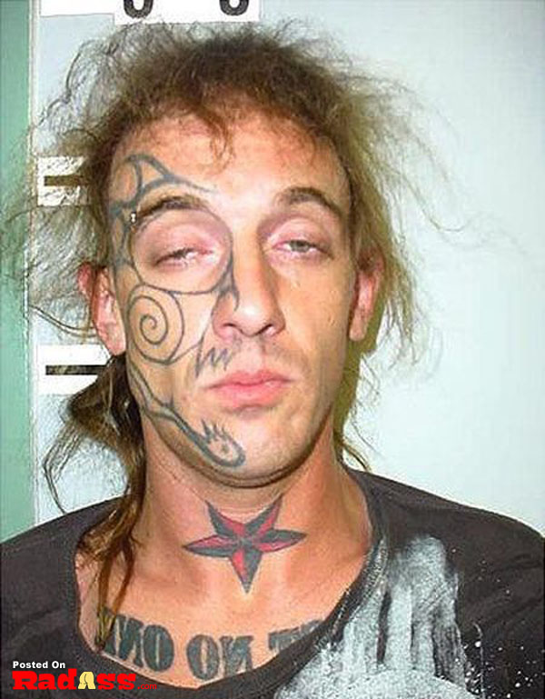A man with a permanent face tattoo.