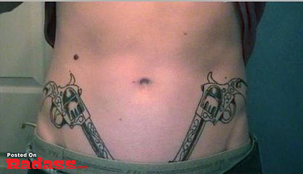 A woman boasting a gun tattoo on her stomach, one of the 32 people packing for life.