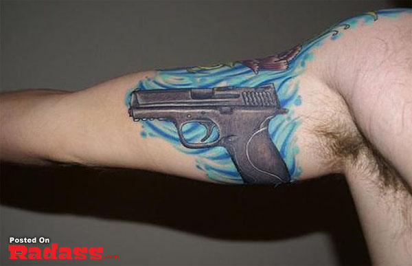 A man with a gun tattoo.