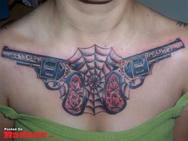 A woman flaunting her chest tattoo, packing two guns.
