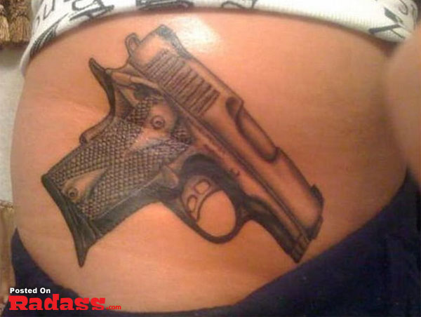 A woman sporting a stomach tattoo of a firearm, joining the ranks of the 32 people packing for life.