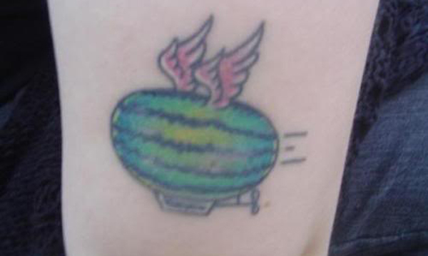 A regrettable tattoo featuring a winged water balloon that symbolizes a permanent bad decision.
