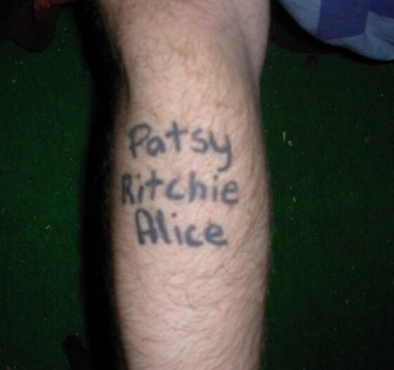 A man with a permanent tattoo that says patty kitty alice.