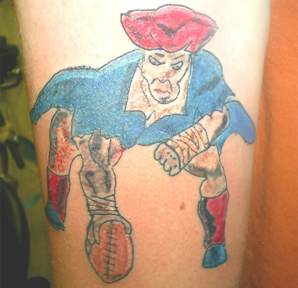 A permanent tattoo showcasing an ill-advised choice of a man holding a football.