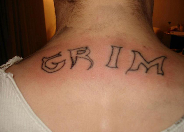A permanent tattoo on the back of the neck showcasing the word grim, symbolizing a lasting reminder of a regrettable choice.