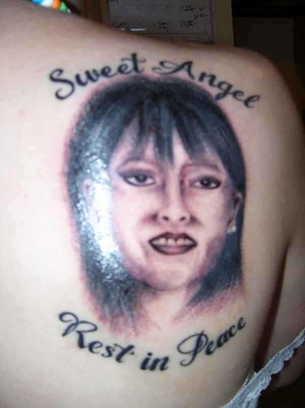 A regrettable tattoo with a woman and the words sweet angel rest in peace.