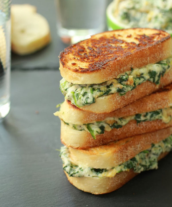 A tantalizing stack of grilled sandwiches oozing with spinach and cheese - food porn at its finest!