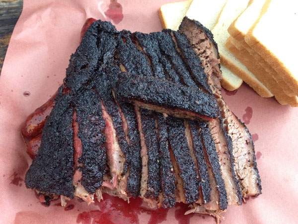 A succulent brisket meticulously presented on a mouthwatering paper canvas.