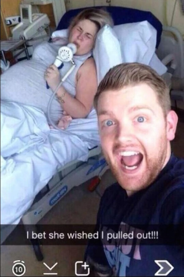 A man captures a hilarious Snapchat moment with a baby in his arms while in a hospital bed.