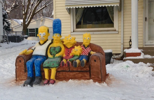 A Snow Art sculpture features the Simpsons family on a couch in wintry surroundings.