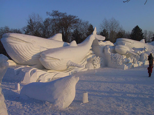 Whale and seal snow sculptures bring joy to the winter season.