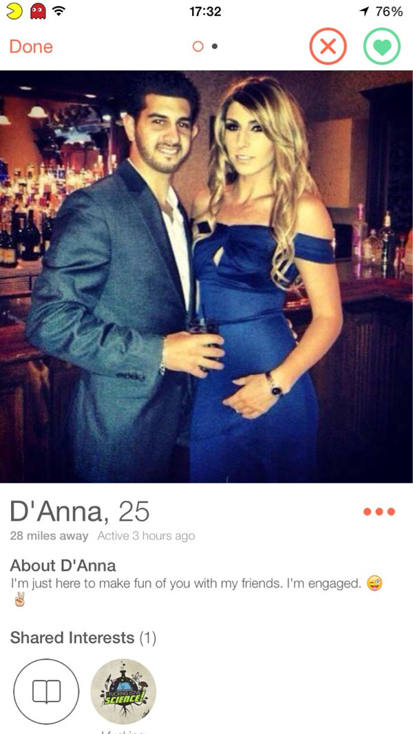 Our Top Tinder Finds of the Week - A man and woman pose for a dating app photo.
