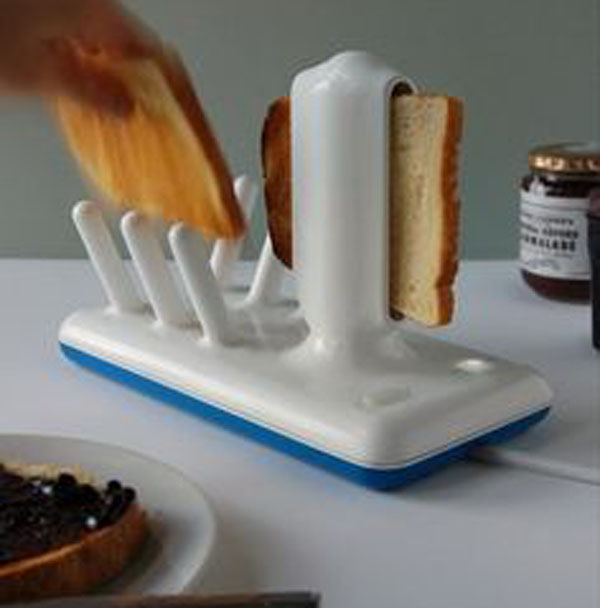 A person cutting bread with a toaster in a frenzy of 