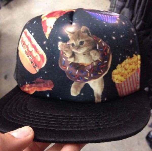 A cat-themed hat adorned with delicious food.