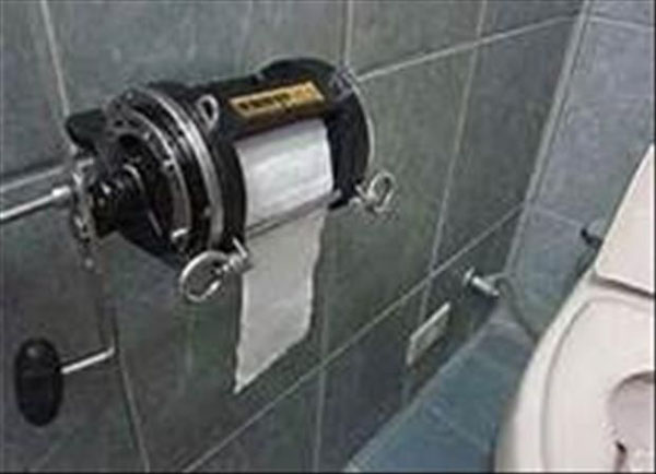 A toilet with a convenient toilet paper holder.